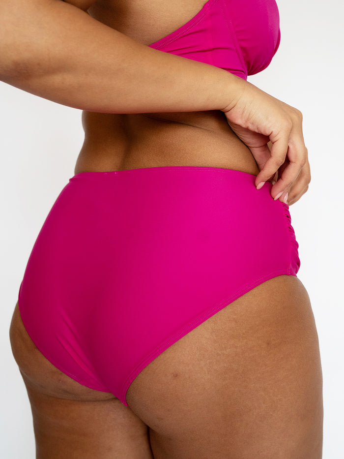 High waisted full coverage bikini bottoms with invisible tummy control in bright pink